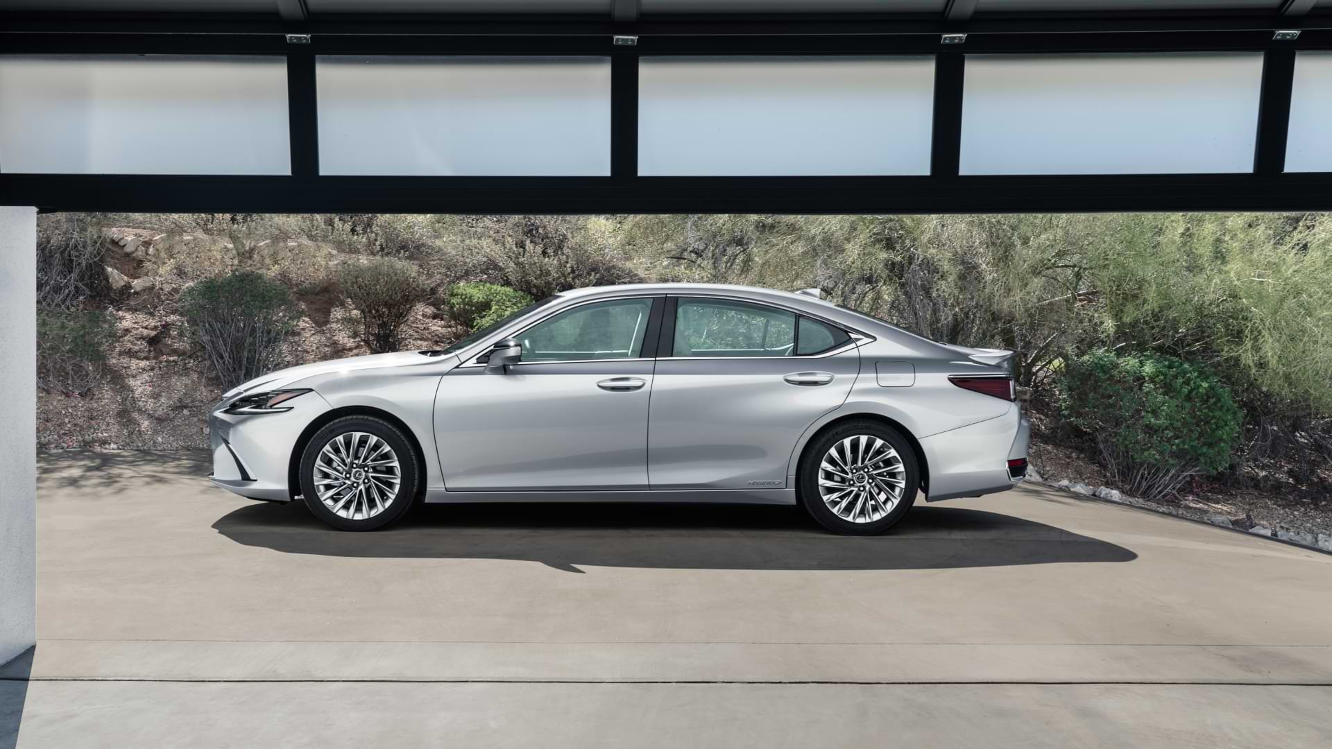 Side on view of a 2021 Lexus ES, parked outside a garage.